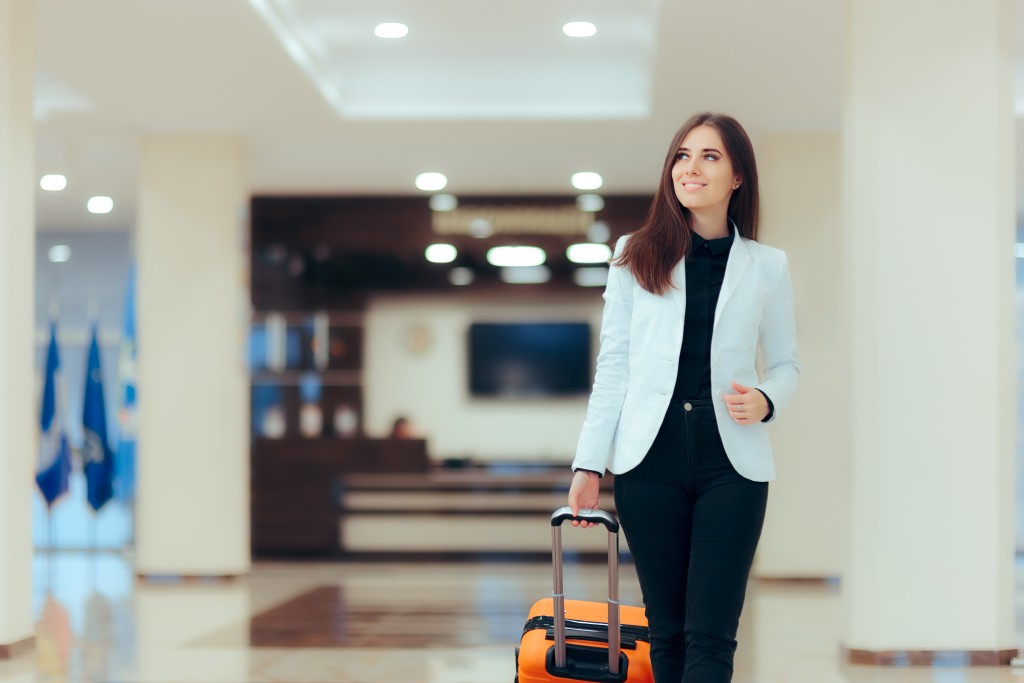 woman walking around with her luggage
