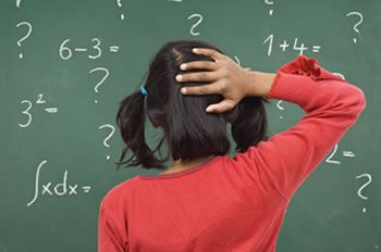Girl facing the blackboard